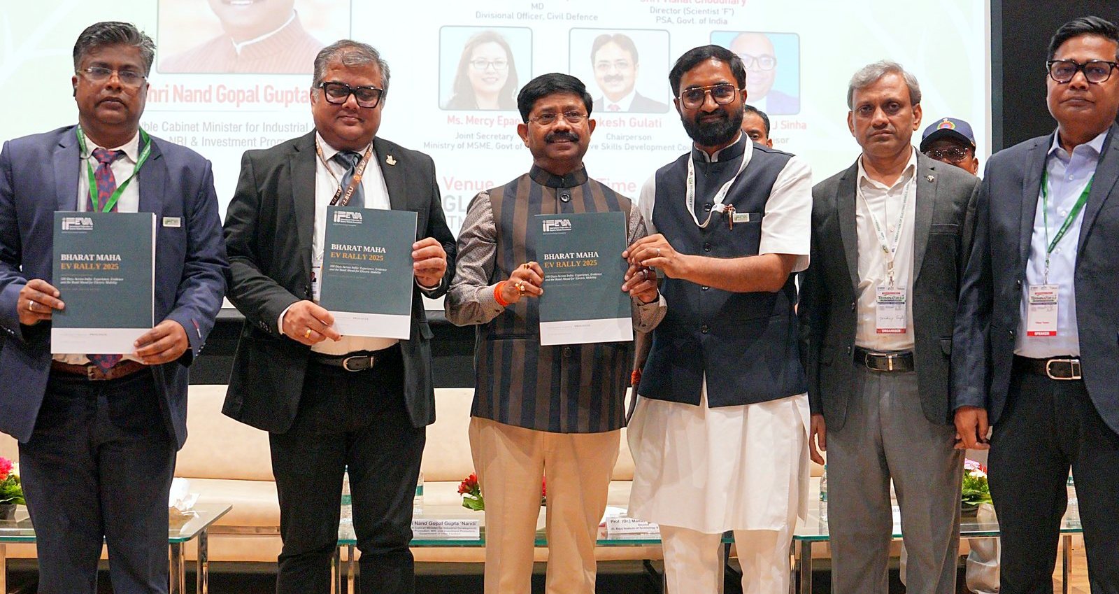 Release of the Bharat Maha EV Rally 2025 Impact and Policy Report on stage at TERMINATOR 5.0, with dignitaries holding copies of the report.